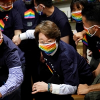 Tokyo 2020 President Seiko Hashimoto with representatives, staff and guests during a visit to Pride House Tokyo Legacy in April.  | REUTERS