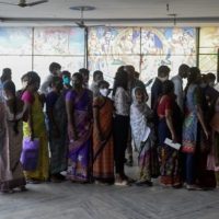 People line up to register for a dose of the Covishield COVID-19 vaccine at an Hindu temple on the outskirts of in Hyderabad on July 15.  | AFP-JIJI