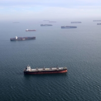 Containerships and oil tankers wait in outside the Port of Long Beach-Port of Los Angeles complex in April. | REUTERS 