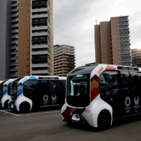 Electric vehicles are used for internal shuttle services at the athletes\' village for the Tokyo Olympic and Paralympic Games. | REUTERS