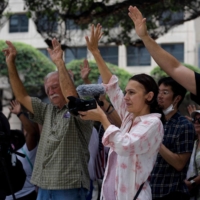 Anti-vaccine protesters pray outside of Houston Methodist Hospital in Houston, Texas | AFP-JIJI