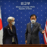 U.S. Deputy Secretary of State Wendy Sherman and South Korean Foreign Minister Chung Eui-yong talk prior to their meeting at the foreign ministry in Seoul on Thursday.  | POOL / VIA REUTERS