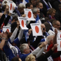 Turbine Potsdam supporters hold up placards in sympathy with Japan before the German women\'s cup final on March 26, 2011, in Cologne, Germany. | REUTERS