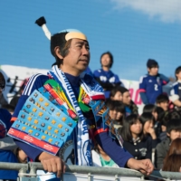 Tsunoda\'s homemade samurai armor and chonmage topknot have made him a celebrity at international sporting events. | DAN ORLOWITZ