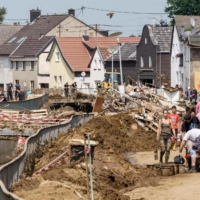 Volunteers work on a muddy street in Swisttal-Odendorf, in Germany\'s North Rhine-Westphalia, on Thursday.  | AFP-JIJI