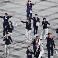 Taiwanese flag bearerers lead the delegation during the opening ceremony of the Tokyo Olympics at the National Stadium on Friday. | AFP-JIJI
