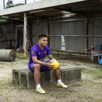 Pyae Lyan Aung, a professional soccer player, sits at a practice field in Osaka on June 26, 2021.  | SHIHO FUKADA/THE NEW YORK TIMES