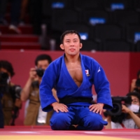 Naohisa Takato celebrates winning the judo men\'s under-60 kg gold medal bout on Saturday at Nippon Budokan in Tokyo. | AFP-JIJI