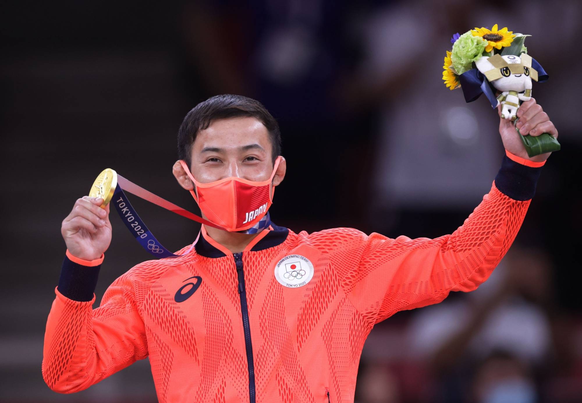Naohisa Takato celebrates after winning the gold medal in the men's judo under-60 kg competition at the Tokyo Olympics at Nippon Budokan on Saturday. The medal was Japan's first gold of the Tokyo Games. | REUTERS