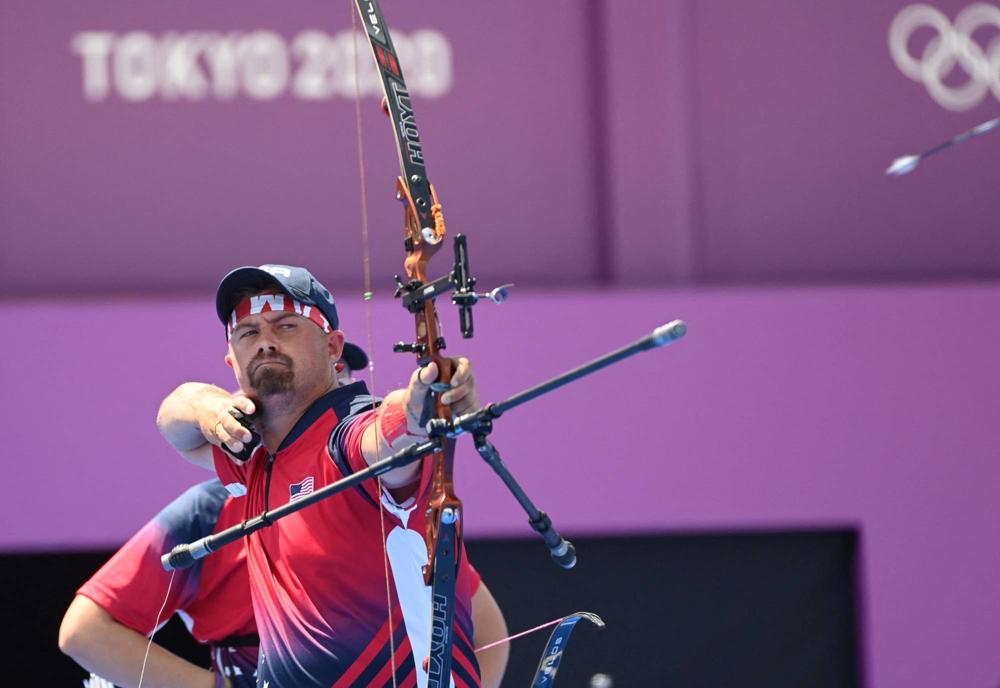Team USA's Brady Ellison competes in the mixed team eliminations at Yumenoshima Park Archery Field in Tokyo on Saturday. | AFP-JIJI