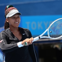 Naomi Osaka trains at Ariake Tennis Park in Tokyo on Friday. She will play her first match of the Olympics at around 1 p.m. Sunday.  | REUTERS