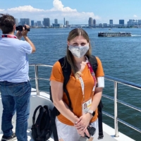 A member of the foreign press covering the Tokyo Olympics joins a boat tour on Thursday. | COURTESY OF PARTICIPANT / VIA KYODO
