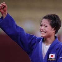 Japan\'s Uta Abe celebrates after winning gold at Nippon Budokan in Tokyo on Sunday. | REUTERS