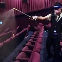 Disinfection work at a cinema in Taipei ahead of eased COVID-19 restrictions | REUTERS 