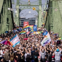 Demonstrators march during the annual Pride parade in Budapest on Saturday,. Brussels is threatening action over an LGBTQ law that could involve cutting funds to Budapest. | BLOOMBERG 