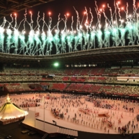 Fireworks above the Olympic Stadium during the opening ceremony of the 2020 Tokyo Olympics. | JAMES HILL / THE NEW YORK TIMES