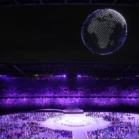 Olympic organizers utilized 1,824 drones to put on a dazzling aerial display that was visible even to those outside the stadium.  | CHANG W. LEE / THE NEW YORK TIMES
