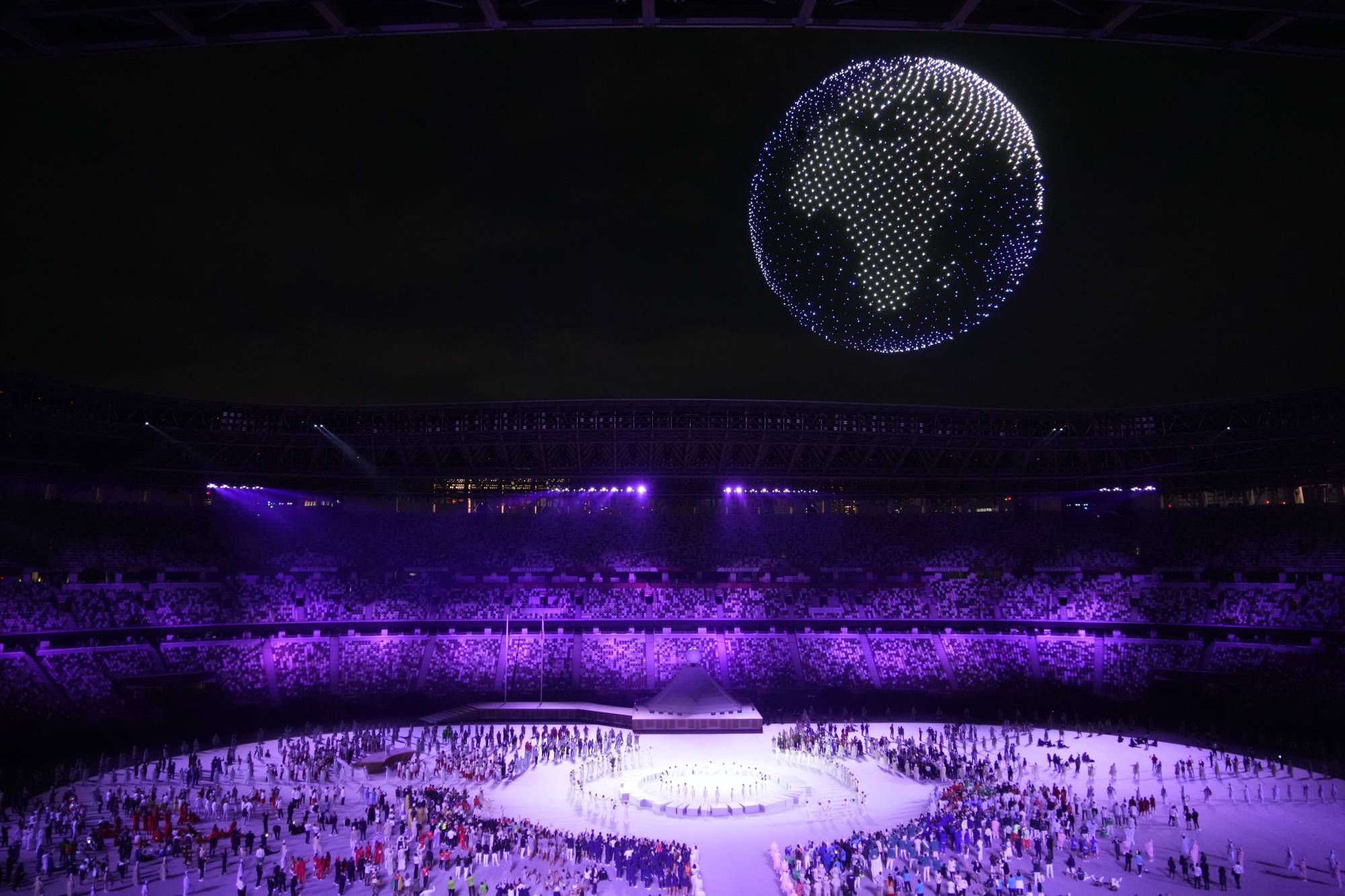 Olympic organizers utilized 1,824 drones to put on a dazzling aerial display that was visible even to those outside the stadium. | CHANG W. LEE / THE NEW YORK TIMES