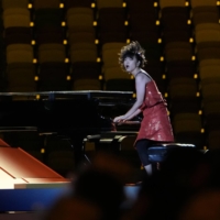 Japanese jazz pianist Hiromi Uehara gave a energetic performance at the Tokyo Olympics opening ceremony. | DOUG MILLS / THE NEW YORK TIMES