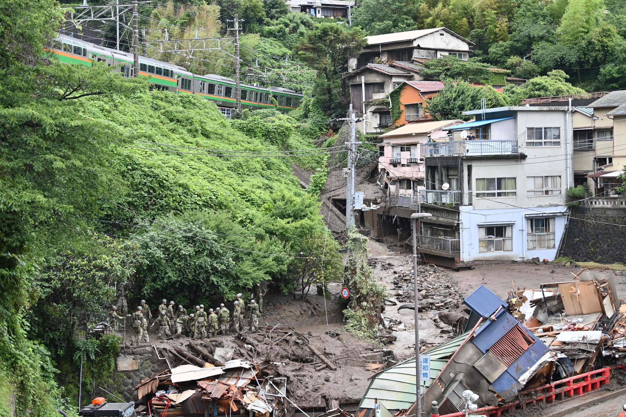 Self-Defense Forces search for missing people at a landslide in Atami, Shizuoka Prefecture, on July 5. | AFP-JIJI