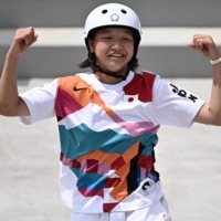 Japan\'s Momiji Nishiya celebrates after performing a trick during the skateboarding women\'s street final in Tokyo on Monday. The 13-year-old took gold in the competition.  | AFP-JIJI