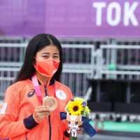 Japan\'s Funa Nakayama poses with her bronze medal during the medal ceremony on Monday in Tokyo.  | REUTERS