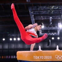 Daiki Hashimoto performs on the pommel horse during the men\'s gymnastics team competition at the Tokyo Olympics on Monday. | REUTERS