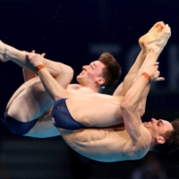 Tom Daley and Matty Lee of Britain in action at the Tokyo Aquatics Centre on Monday  | REUTERS 