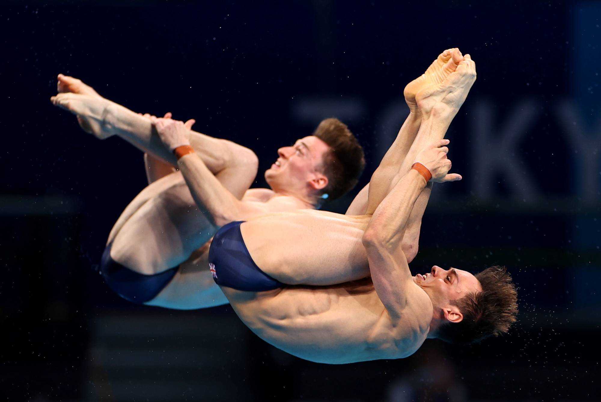 Tom Daley and Matty Lee of Britain in action at the Tokyo Aquatics Centre on Monday  | REUTERS 