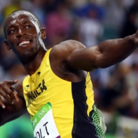 Usain Bolt celebrates winning gold in the men\'s 200-meter race at the Rio Olympics. | REUTERS