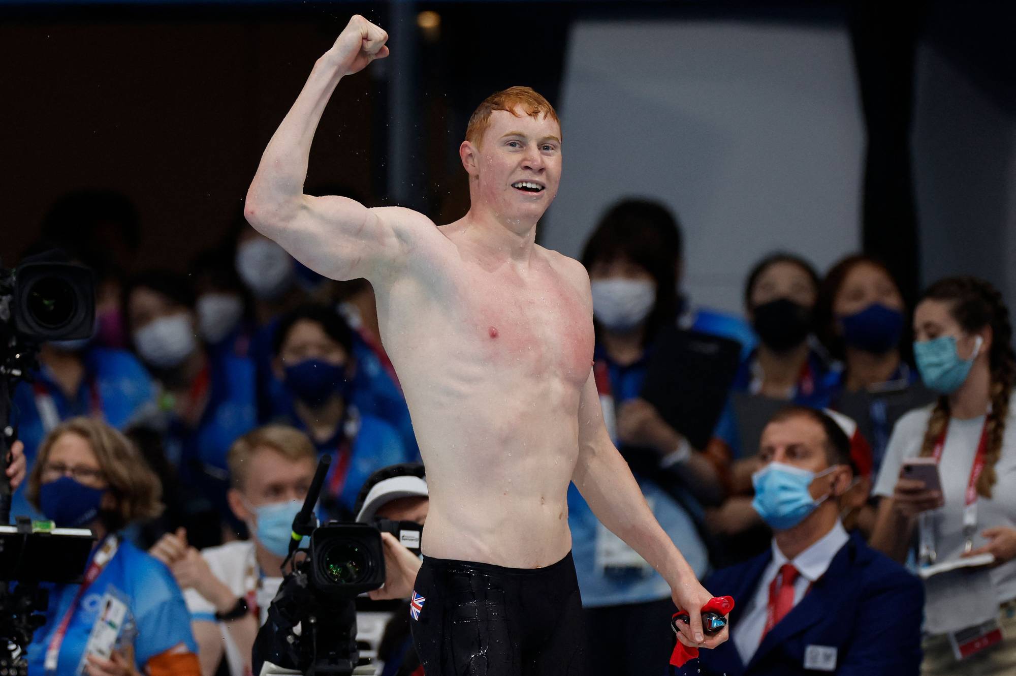 Britain's Tom Dean celebrates winning the gold medal in the men's 200-meter freestyle at the Tokyo Aquatics Centre on Tuesday. | AFP-JIJI