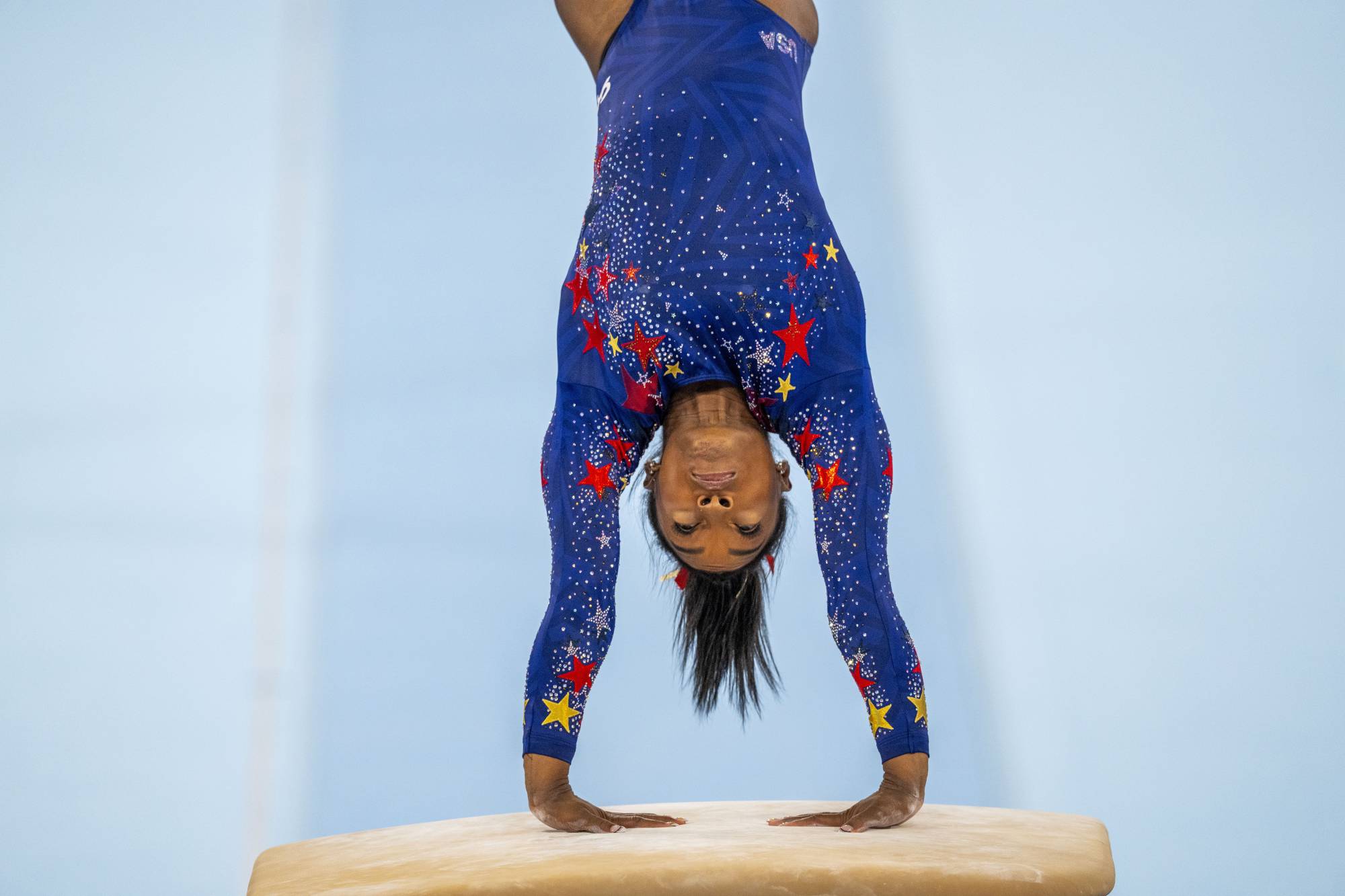 Simone Biles, of the United States, competes on the vault at the Tokyo Olympics on Sunday. | DOUG MILLS /THE NEW YORK TIMES