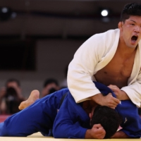 Japan\'s Shohei Ono (white) and Georgia\'s Lasha Shavdatuashvili compete in the judo men\'s -73kg final bout during the Tokyo 2020 Olympic Games at the Nippon Budokan in Tokyo on July 26, 2021. (Photo by Jack GUEZ / AFP) | JAPAN\'S SHOHEI ONO (WHITE) AND GEORGIA\'S LASHA SHAVDATUASHVILI COMPETE IN THE JUDO MEN\'S -73KG FINAL BOUT DURING THE TOKYO 2020 OLYMPIC GAMES AT THE NIPPON BUDOKAN IN TOKYO ON JULY 26, 2021. (PHOTO BY JACK GUEZ / AFP)