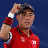 Kei Nishikori celebrates after winning his second-round match on Tuesday at Ariake Tennis Park.  | REUTERS