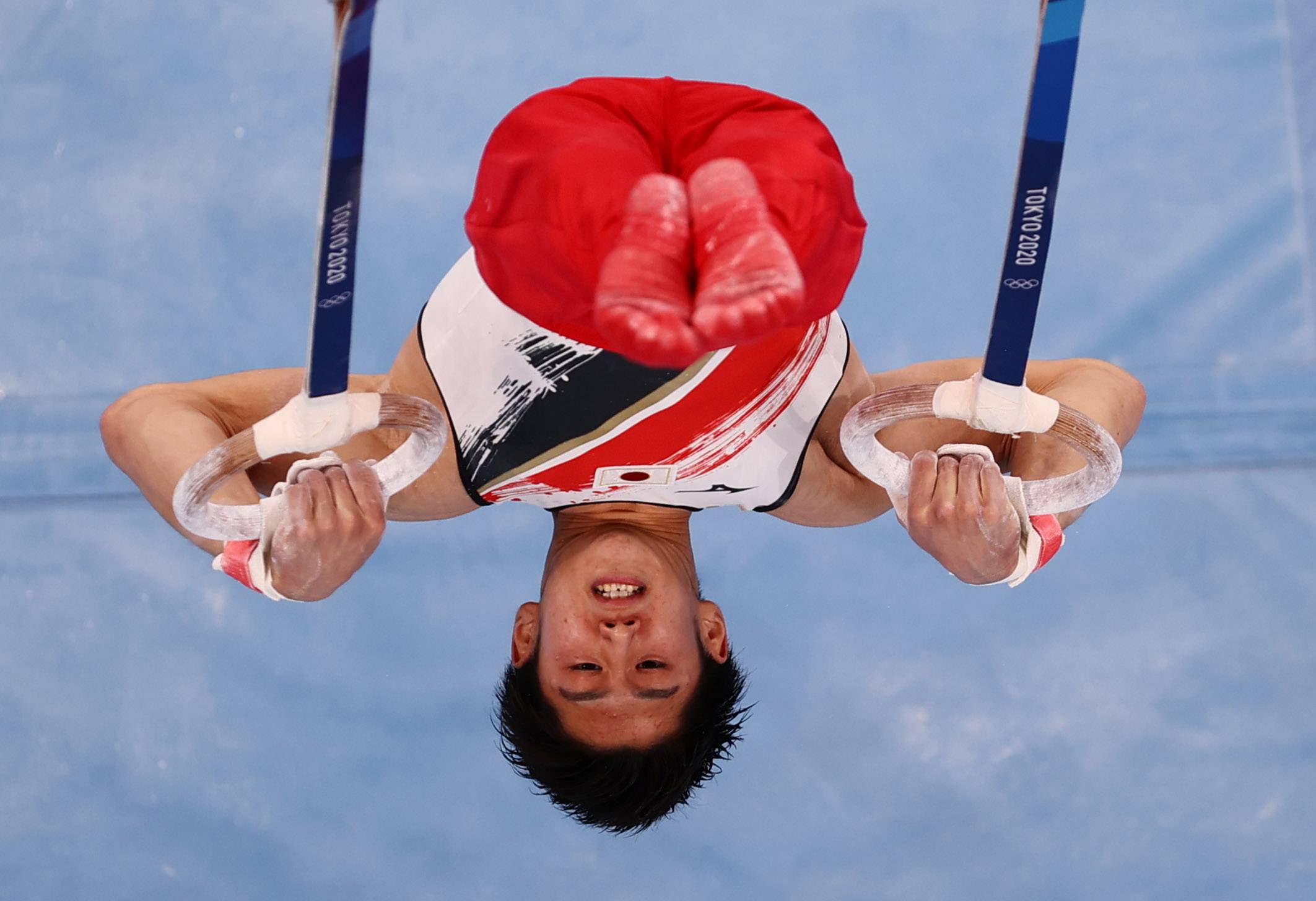Daiki Hashimoto of Japan performs on the rings during the men's team final at Ariake Gymnastics Centre on Monday. | REUTERS