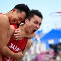 Japan\'s Keisei Tominaga and Tomoya Ochiai celebrate after wining after their first 3x3 basketball match against China. | AFP-JIJI