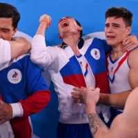 Russian Olympic Committee athletes — Artur Dalaloyan, David Belyavskiy, Denis Abliazin and  Nikita Nagornyy  — celebrate after winning gold in the artistic gymnastics. | REUTERS
