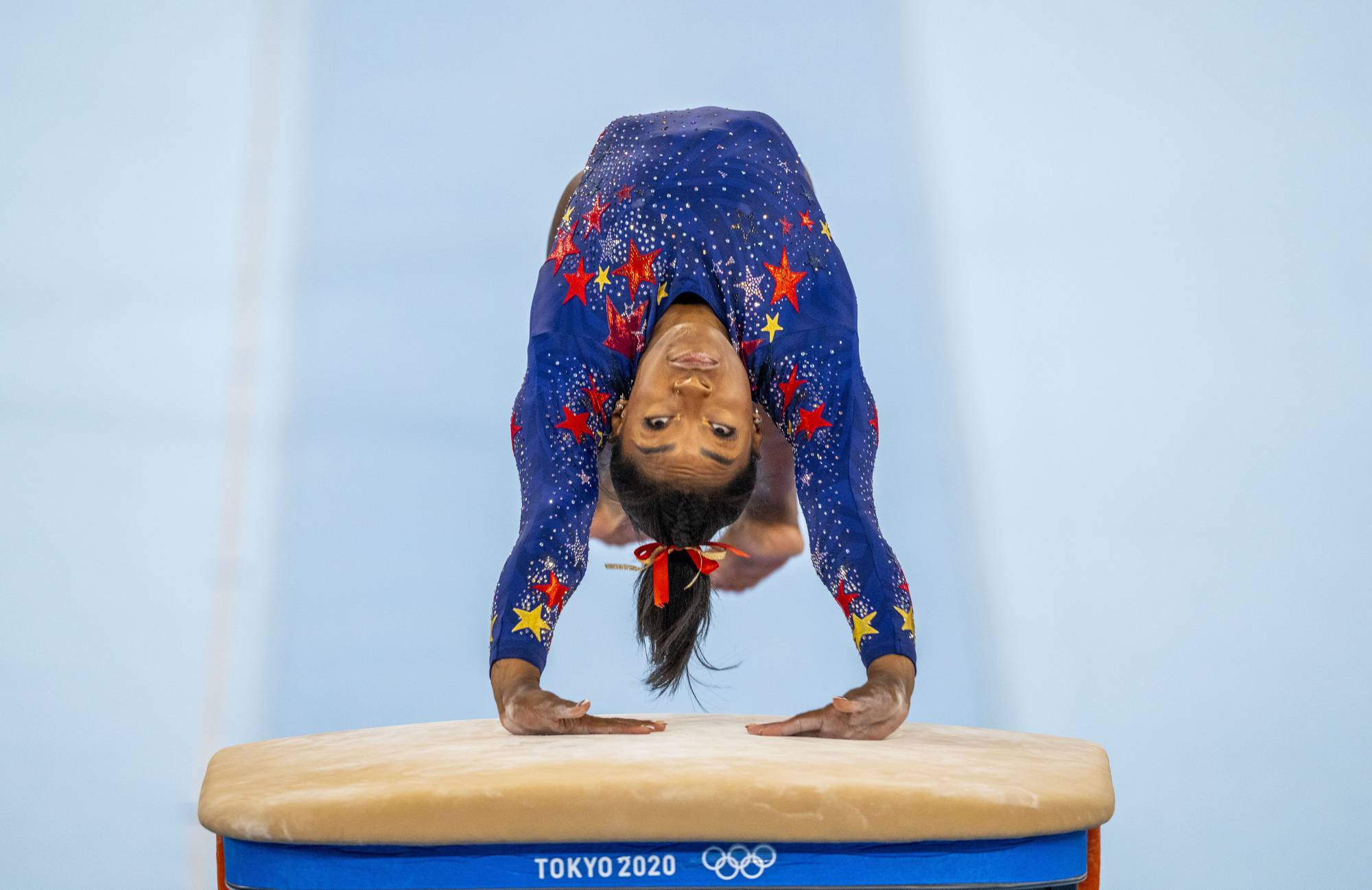 Simone Biles of the United States competes on the vault in Tokyo on July 25. | DOUG MILLS / THE NEW YORK TIMES