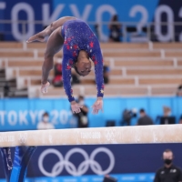 Simone Biles of the United States competes on the balance beam in Tokyo on July 25. | CHANG W. LEE / THE NEW YORK TIMES