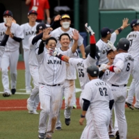 Japan\'s baseball team celebrates a walk-off win over the Dominican Republic on Wednesday at Fukushima Azuma Baseball Stadium.  | AFP-JIJI