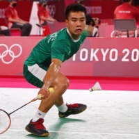  Ireland\'s Nhat Nguyen competes against Taiwan\'s Wang Tzu-Wei during the badminton men\'s singles. | REUTERS