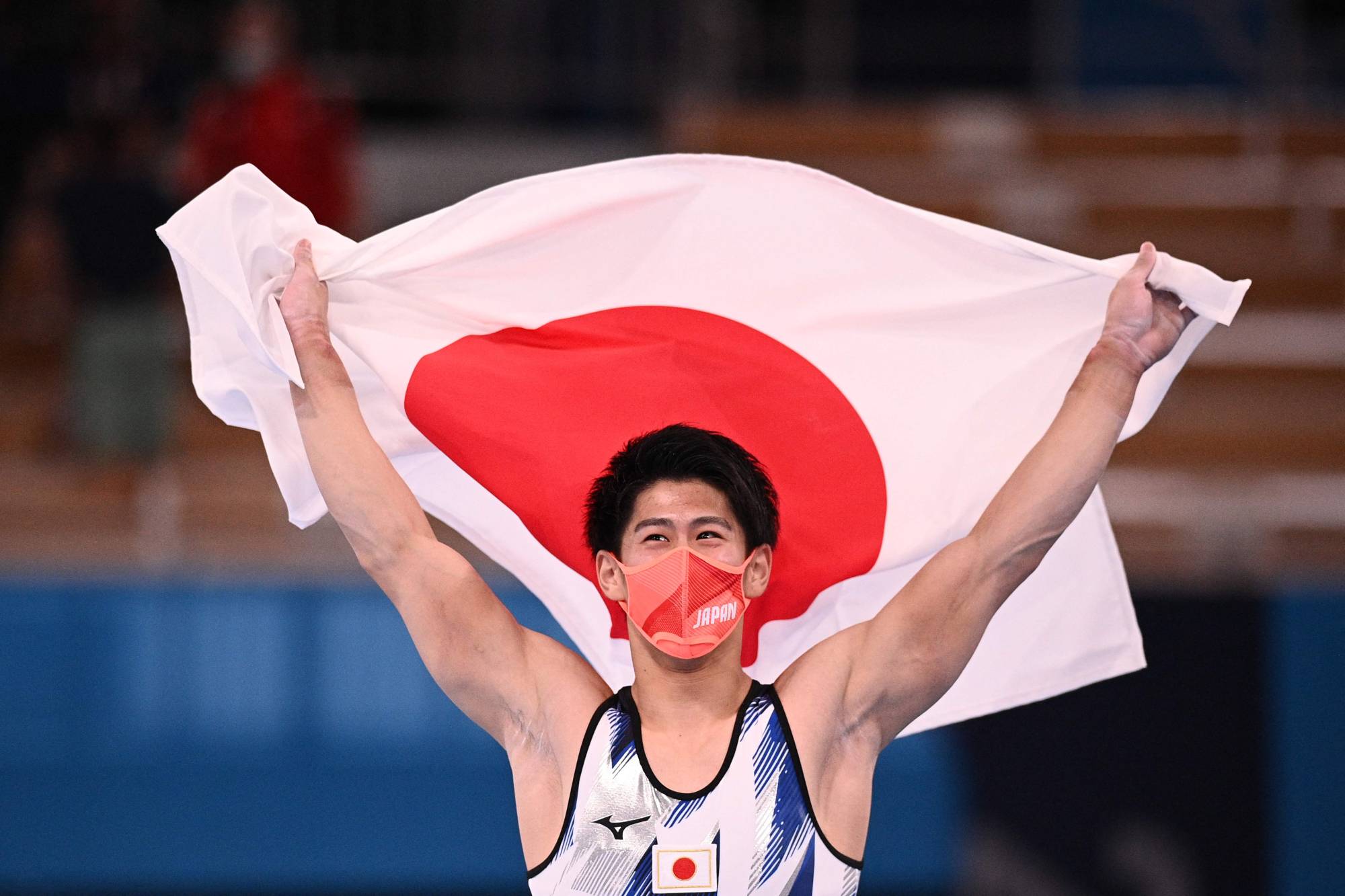 Japan's Daiki Hashimoto celebrates after winning the artistic gymnastics men's all-around final. | AFP-JIJI