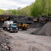 Waste coal is loaded into a truck at an Abandoned Mine Land reclamation site in Clinchco. | REUTERS 