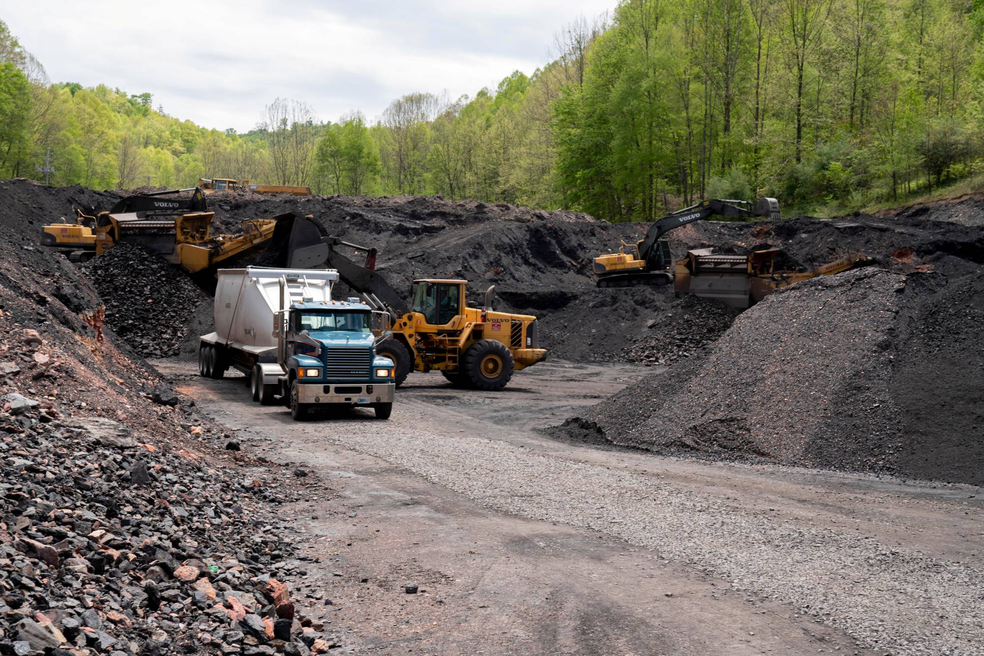 Waste coal is loaded into a truck at an Abandoned Mine Land reclamation site in Clinchco. | Reuters 
