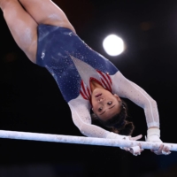Gymnast Sunisa Lee of the United States in action on the uneven bars on Thursday. | REUTERS