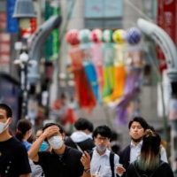 People at the Shibuya crossing in Tokyo on Thursday
 | REUTERS