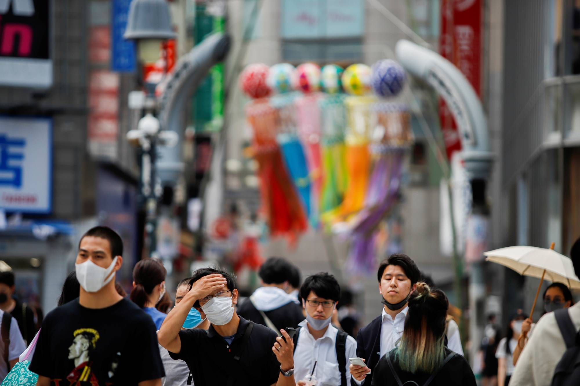 People at the Shibuya crossing in Tokyo on Thursday | REUTERS