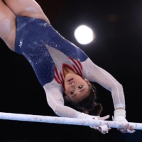 Gymnast Sunisa Lee of the United States in action on the uneven bars on Thursday. | REUTERS