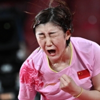 China\'s Chen Meng reacts after defeating China\'s Sun Yingsha during the women\'s singles table tennis final match. | AFP-JIJI