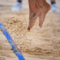 A player takes to flight during the women\'s preliminary beach volleyball match between Australia and Italy | AFP-JIJI